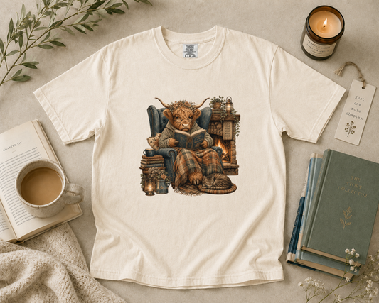 Highland Cow Reading by the Fireplace T-Shirt
